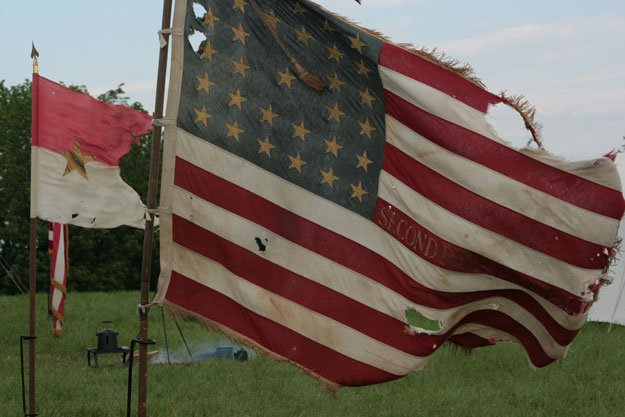 Flags fly at a re-enactment.