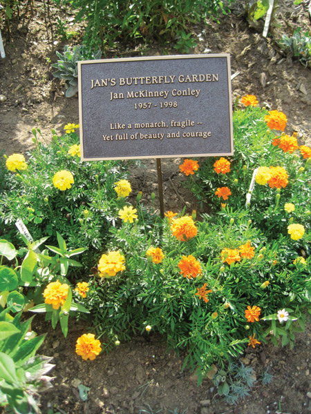 Jan's sign, surrounded by marigolds