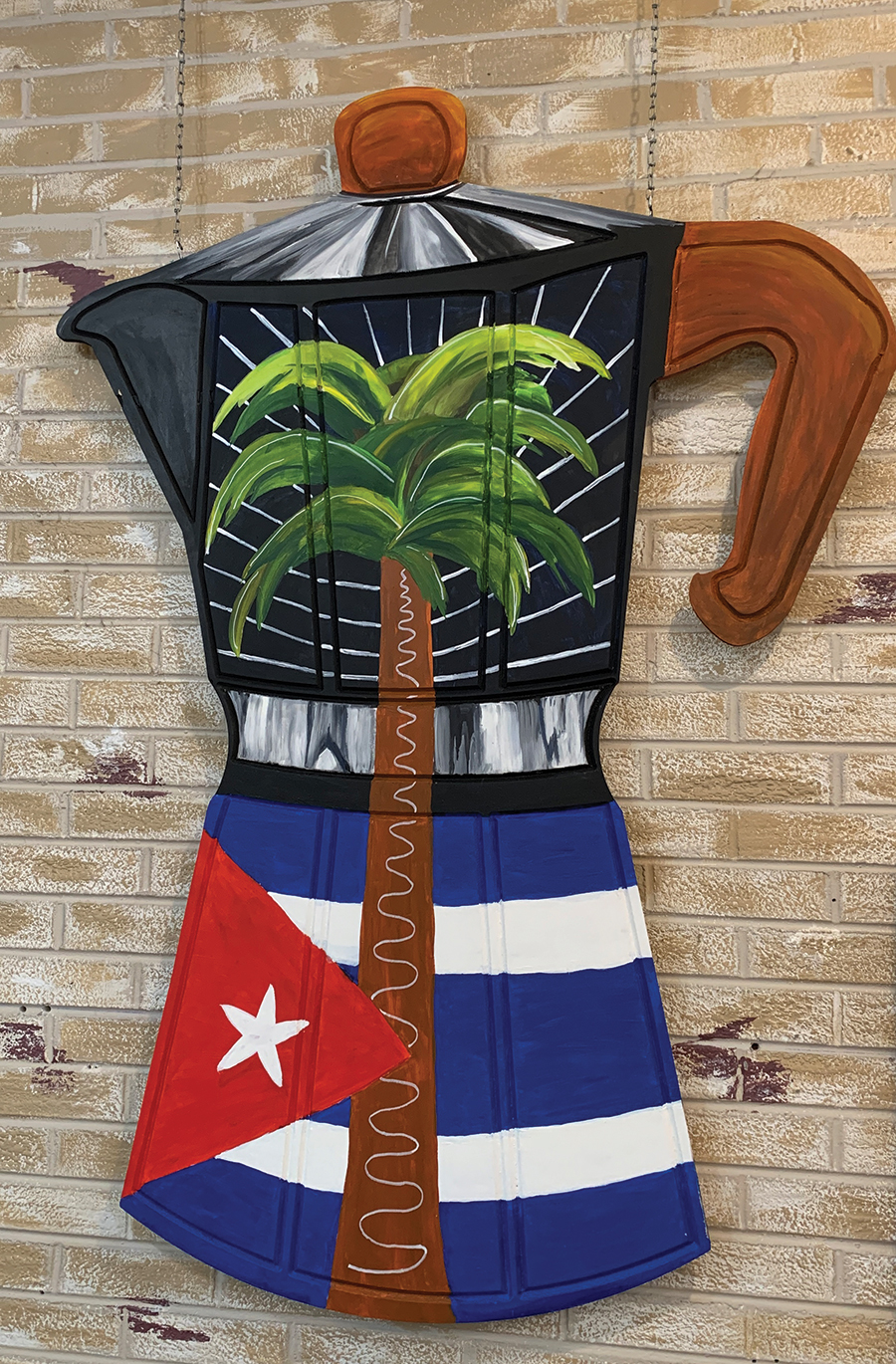 The back wall of Elizabeth Correa’s café in McCaysville pays homage to the coffees of Cuba and corresponds to the Georgia-Tennessee state line.