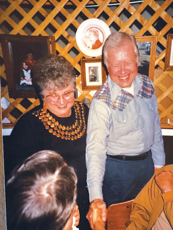 Jacque Holloway and President Carter greet customers at The Pink Pig.