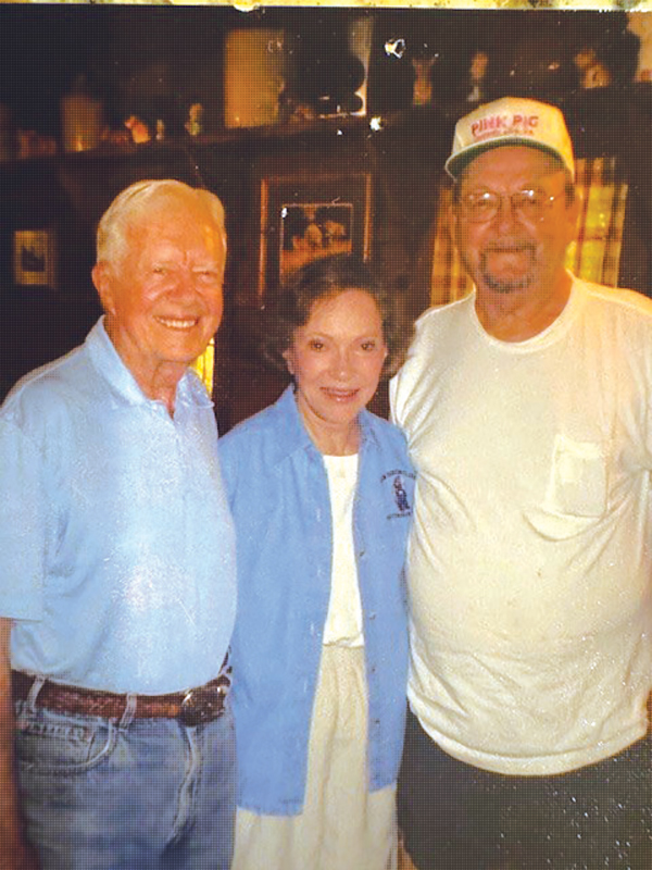 Jimmy and Rosalynn Carter stand with Bud Holloway at The Pink Pig. It’s one of the last visits the Carters made to the restaurant.