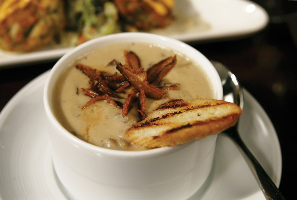 The Roux version of mushroom bisque is garnished with grilled baguettes and splashes of sherry.