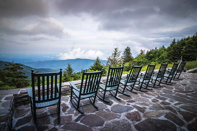 This photo was captured at Blue Ridge Parkway Milepost 355.4 at the Mt. Mitchell State Park Restaurant with a magnificent view of the Black Mountains. From the photographer: “This image was taken on the evening of a summer solstice. A summer storm began to form and roll towards the Blue Ridge Parkway. As the wind picked up and the lightning began to flash, no one was left on the patio except me. I decided to run to my car to avoid the ominous weather myself. I glanced back observing the rocking chairs slowly rocking in the wind. I then snapped one more picture before heading to safety. This haunting image still captivates me today."