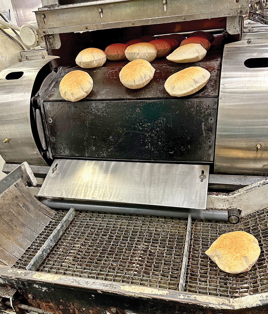 Loaves of pita bread bake in about 30 seconds at around 800 degrees.