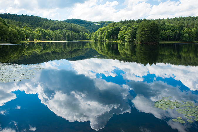 The easy 0.9-mile loop walk around Bass Lake at Cone Manor (North Carolina Blue Ridge Parkway Milepost 294) is a treat any time of year. On a summer day when the clouds and the manor house reflect in the water, it is simply spectacular.