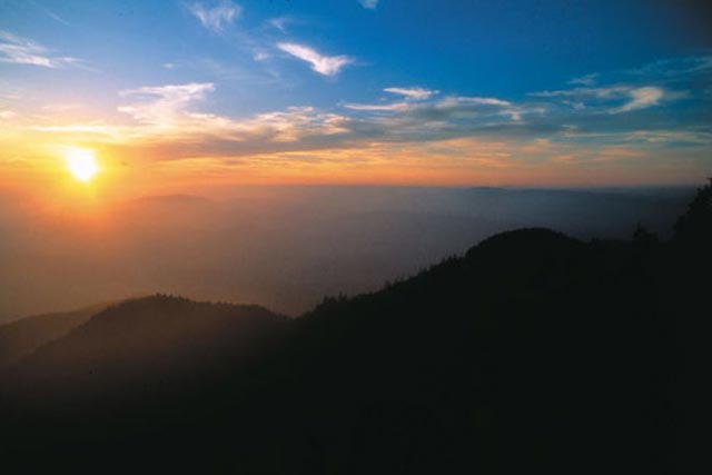 A brilliant fall red touches the trees in a state whose mountains and meadows are filled with history, the heritage of storytelling, the rattling echo of 19th-century stagecoaches, the vibrant activity of artists, the peace of farms hidden in hollows.