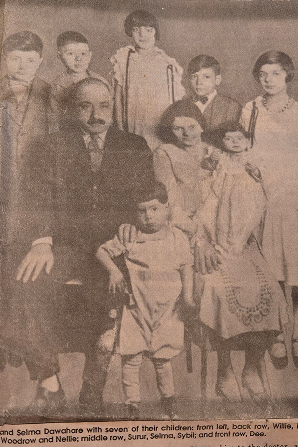 Srur and Selma Dawahare with seven of their children.
