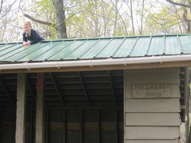 Tyler climbs Fullhardt Knob Shelter roof after climbing Fullhardt Knob