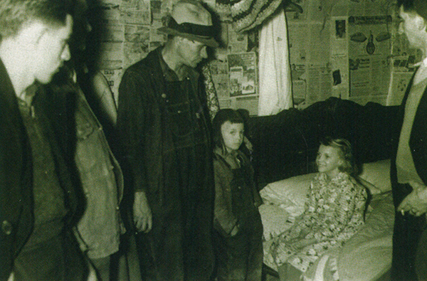 Bertha Sybert, 1938. Neighbors and newspaper writers came to the Sybert home to watch the phenomenon of Bertha on the bed.