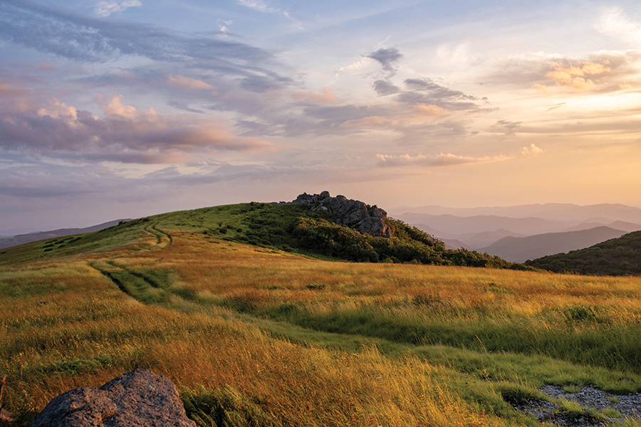 Whitetop Mountain in Virginia’s Grayson Highlands. From the photographer: “I was so fortunate to capture this amazing light as wispy clouds floated by and soaked in the colors of sunset illuminating the mountain layers in the distance.”