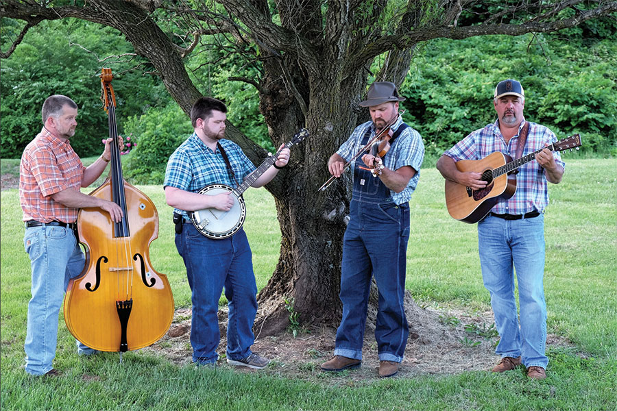 The renowned Twin Creeks Stringband plays old-time music, and features moonshiner Peg Hatcher’s fiddle played by his great-grandson, Chris Prillaman (second from right).