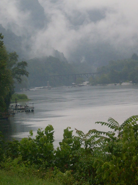 A railroad bridge crosses the New upriver from Gauley Bridge; The Dries are beyond the fog.