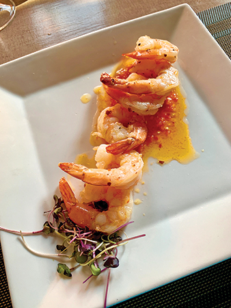 The shrimp comes with house-made piri piri sauce at Bela Lisboa.