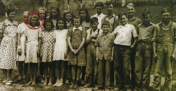Bertha Sybert, circled, poses with classmates two years after her bed bounced her uncontrollably. Bertha Sybert died in 1986, at age 57.