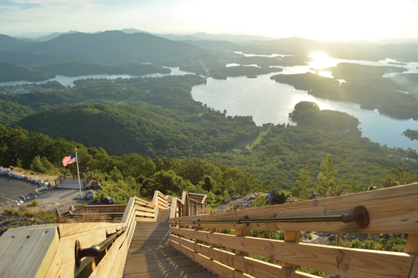 Mountain view of a forest valley containing Lake Chatuge at sunset | Blue Ridge Country