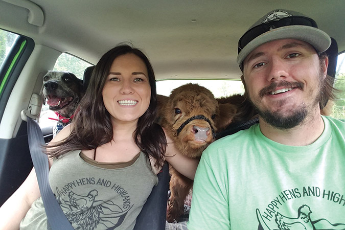 Emily and Adam Hopson ride with Baby James and dog Beulah.