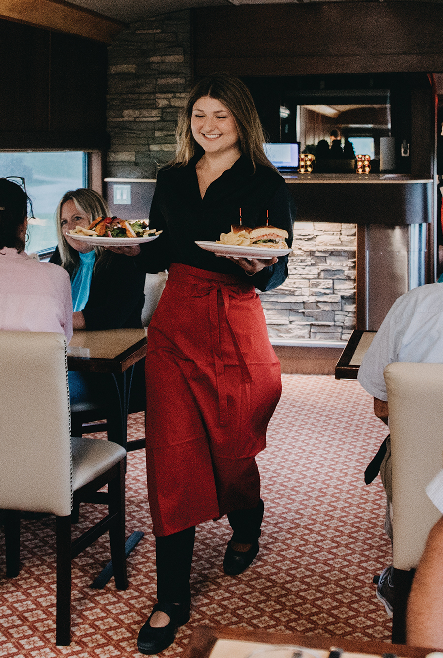 Balancing plates on a moving train requires balance and confidence.