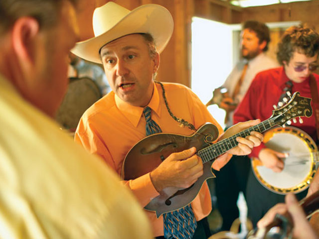 Musicians such as David Davis and the Warrior River Boys – performing here at a Ralph Stanley Festival – keep mountain music alive along the Crooked Road.