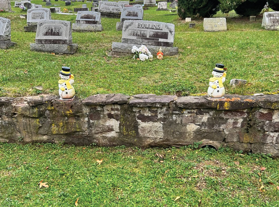 Frostys stand sentinel at the grave of “Frosty the Snowman” songwriter Jack Rollins.