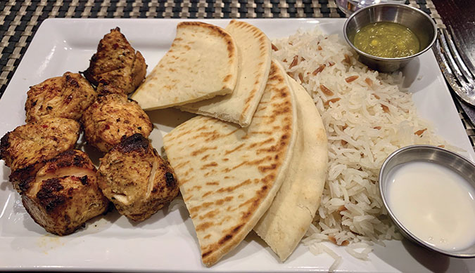 Red Meze kebabs, like this chicken one, are always accompanied by rice with orzo.