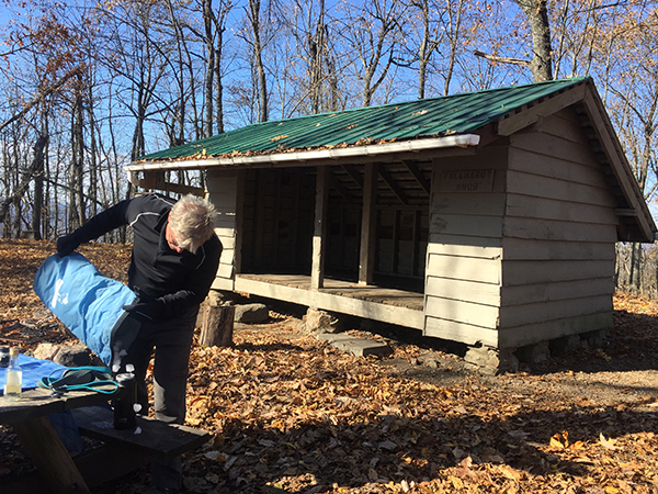 11/9/19: Part of the post-lunch ritual, undertaken here at Fullhart knob Shelter, is to transfer ice from the Ice Mule that keep lunch cool into the water bottle for the walk back.
