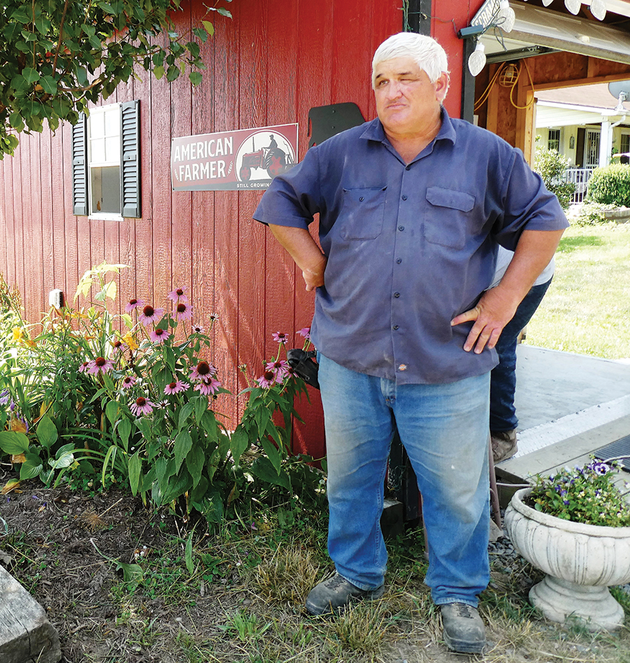 Scott McDaniel, a sixth-generation farmer, stands in front of his newly renovated meat stand as he talks about the importance of the farm to his family.
