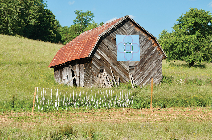 Love and romance is featured on this double wedding ring quilt barn found along the backroads of Avery County, North Carolina. Artist not known.