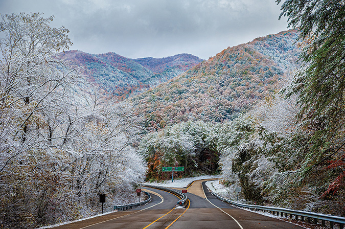 At the eastern terminus of the Foothills Parkway near Cosby, Tennessee. From the photographer: “Taken in early November, the shot shows two seasons in play at once, as snow and hoarfrost coats the still colorful landscape.”