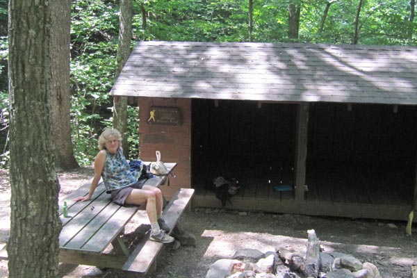 Gail, comfortable on the picnic table at tucked-away Boblett's Gap Shelter.