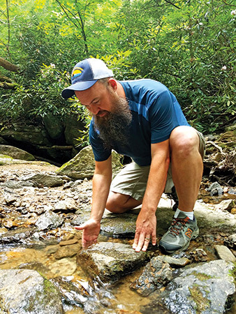 Davenport scours the ponds and streams in his backyard for salamanders, often with his three daughters.