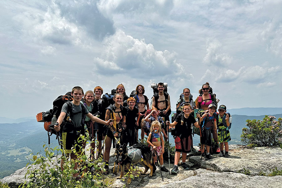 The two kids who chose to sit out the thru-hike joined in to tackle “Virginia’s Triple Crown.” Here, all but the cameraman pose at Tinker Cliffs, at 2,917 feet one of the three high points of the triple crown, along the Dragon’s Tooth and McAfee Knob.