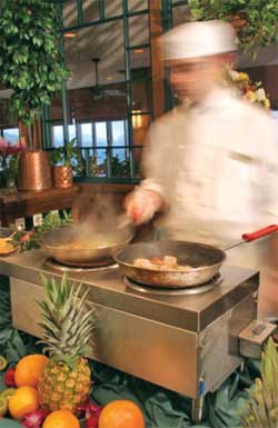 The staff at Asheville, N.C.’s Grove Park Inn Resort & Spa create such regionally inspired dishes as shrimp and grits with ham gravy.