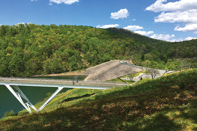 This present-day view of the dam is from the visitor center, with the road winding along the top.