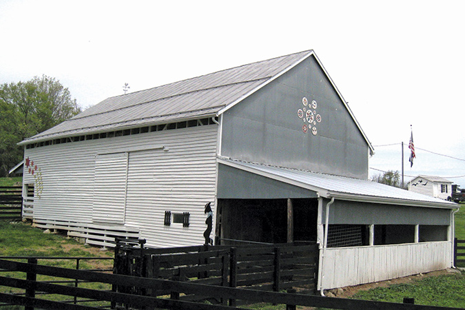 The tin and wood siding on the outside of the James Wellard barn helped preserve the history of the old logs tucked beneath.