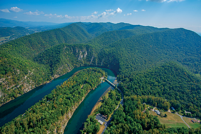Shot from a helicopter, this Horseshoe section of the Watauga River is along Wilbur Lake, Tennessee. The Appalachian Trail traverses the over 6,000-acre Big Laurel Branch Wilderness along the ridge-top in this photo.
