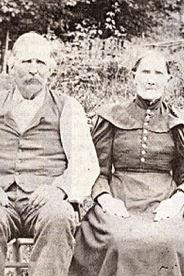 Orelena Puckett sits with her husband John, circa 1912.