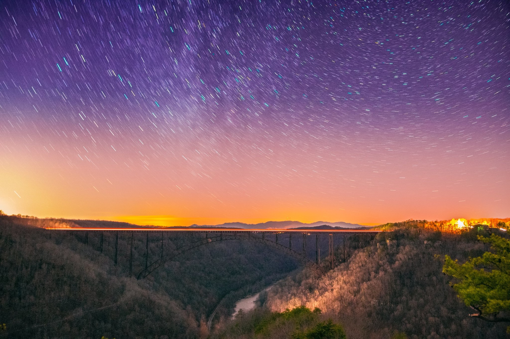 Long Point Soliloquy

"Looking at these stars suddenly dwarfed my own troubles and all the gravities of terrestrial life. I thought of their unfathomable distance, and the slow inevitable drift of their movements out of the unknown past into the unknown future."
— H. G. Wells, The Time Machine

A long exposure depicts the movement of stars over the New River Gorge bridge in West Virginia just after twilight.

Feel free to share!

Prints and other infor: http://www.reflectioninapool.com/
— at Long Point Trail - New River Gorge.