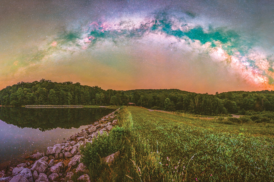 "Summit Lake is at 3,400’ in elevation and the Cranberry Glades Wilderness surround it to create a great place to shoot a springtime Milky Way panorama. North is to left, east at the center and the southern sky is on the right." —Dave Green
