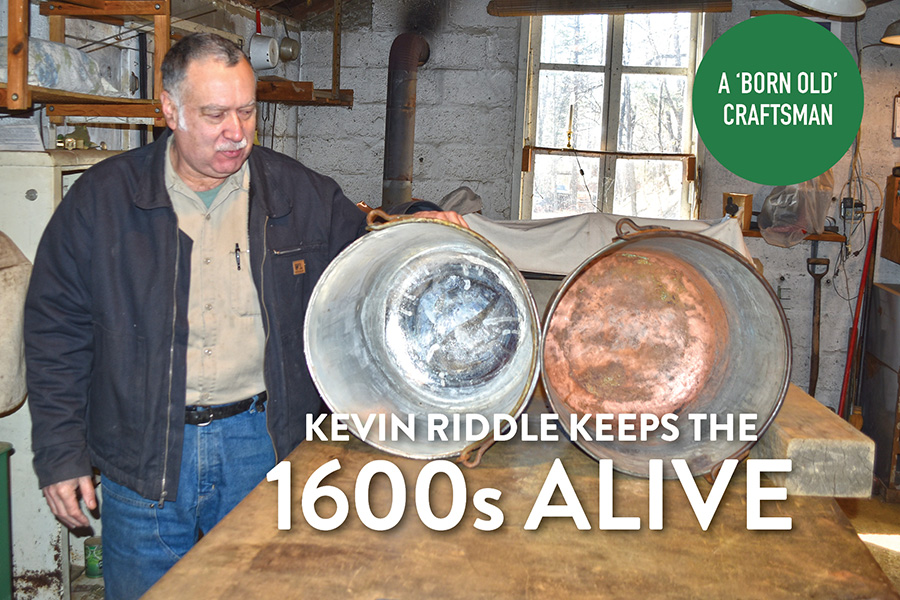 Kevin Riddle displays two reproduction copper pots from Virginia’s Jamestown Settlement. He has mostly restored the pot on the left; the one on the right has not been re-tinned yet.