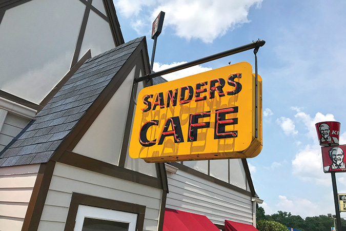 The Sanders Café sign marks the entrance to the restaurant museum at a Kentucky Fried Chicken location in Corbin, Kentucky.