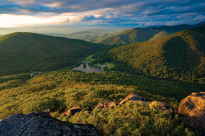 It’s a moody summer evening looking down on Abbott Lake at Milepost 86 as the lake sits in the shadows of a sea of ridges.