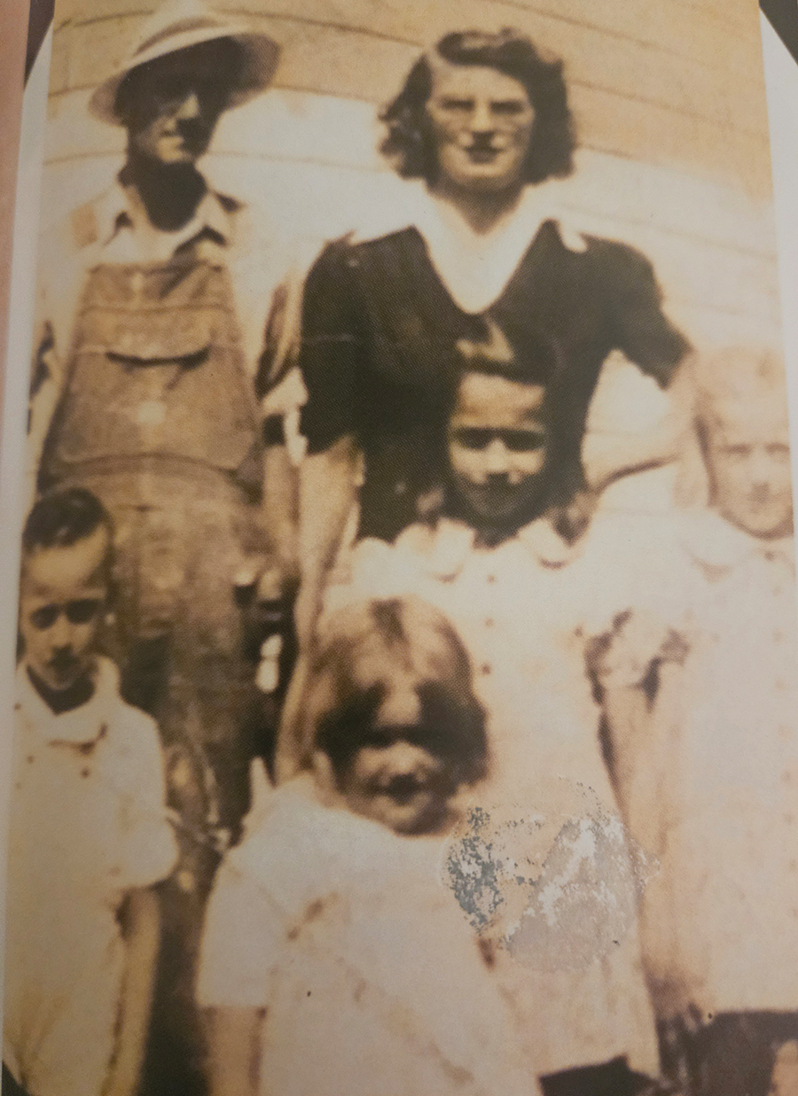 A happy, young Eula in the foreground as the family's youngest girl at the time of photo.