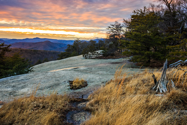 Stone Mountain State Park, NC features a huge granite dome about 600 feet tall. This view is from the trail to the summit of Stone Mountain. The BRP forms the north-side border for the mountain.