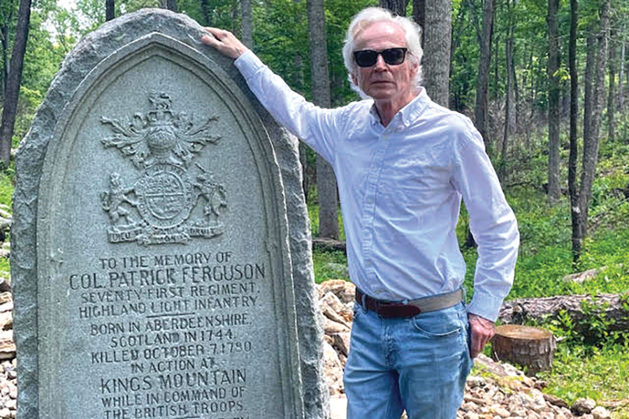 Writer Alan Crawford stands beside the Col. Patrick Ferguson Monument.