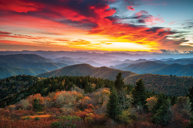 Cowee Mountain Overlook is south of Asheville along the Blue Ridge Parkway at Milepost 430.7, with views of endless mountain ridges to the west. From the photographer: “It was rather cold and quite windy on this particular evening, but the conditions made for some really interesting patterns in the clouds, and what a lovely scene we were lucky enough to stand in front of when the setting sun lit up the sky in vivid color for us.”