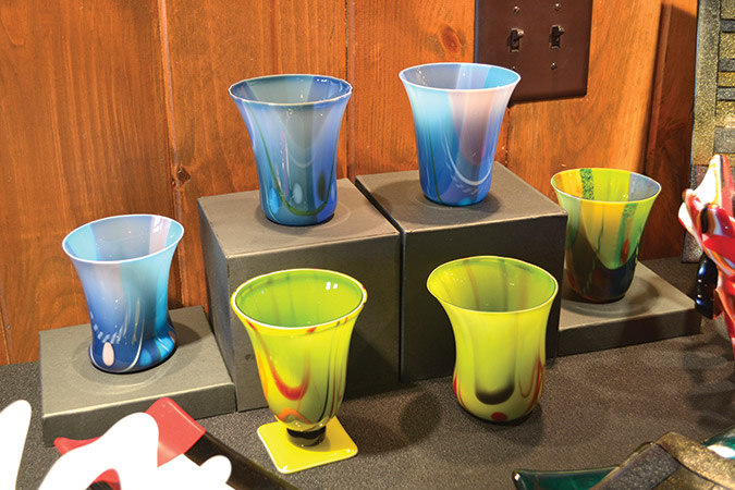 Useful fused glass items are increasing in popularity, and are also one-of-a-kind creations, as seen here in her workshop display in Tiger, Georgia.