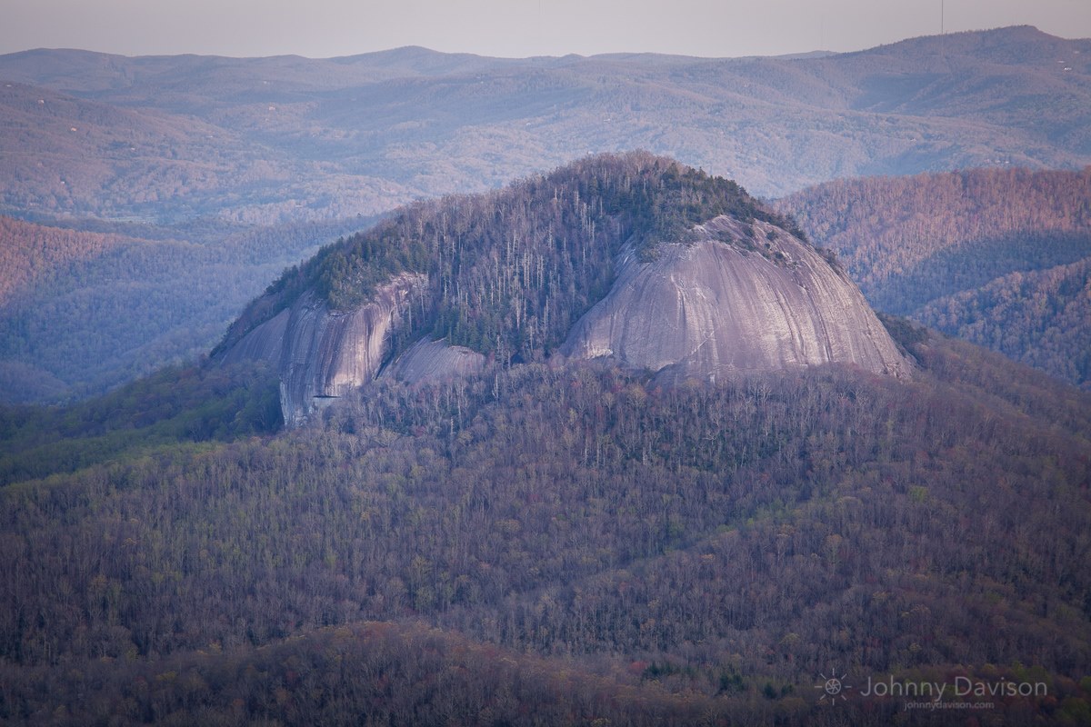 Looking Glass Rock from the Blue Ridge Parkway, near Brevard, NC on Monday, April 18th. The light was dim when this was taken. That's what gives the image it's soft appearance. — at Looking Glass Rock.