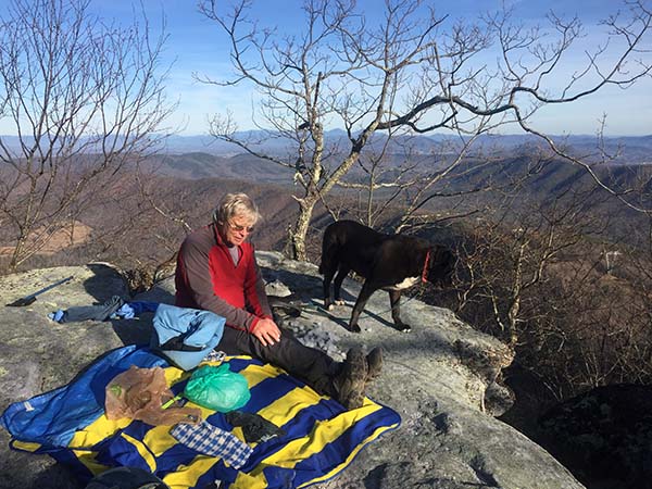 Old man atop McAfee Knob contemplates if he will be able to stand up after lunch.