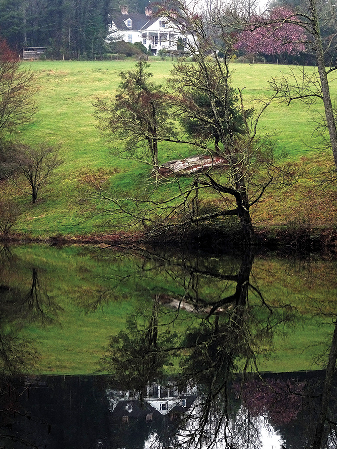 The Sandburg home is reflected in Front Lake.