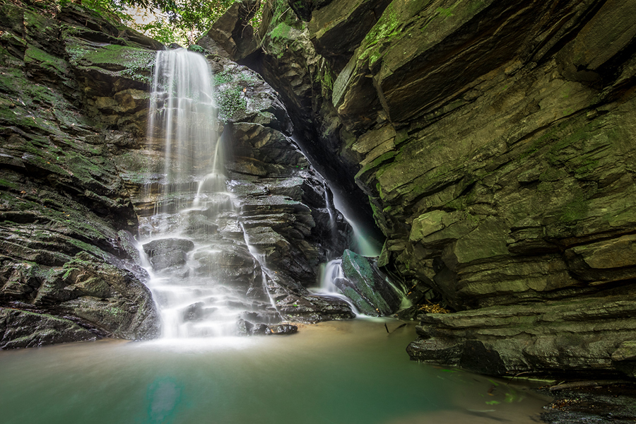 Cavern Falls, North Carolina. From the photographer: “Nestled in the Green River Game Lands, Cavern Falls give you an adventurous, off-trail experience through wild terrain and beautiful forests.  It is a challenge to get to, but the reward when you see this unique waterfall is worth it.  To the right of the main drop, you’ll see a small cavern with a second, smaller waterfall.  If you wade through the main pool, you can reach the cavern and explore the small opening and view the second waterfall.”
